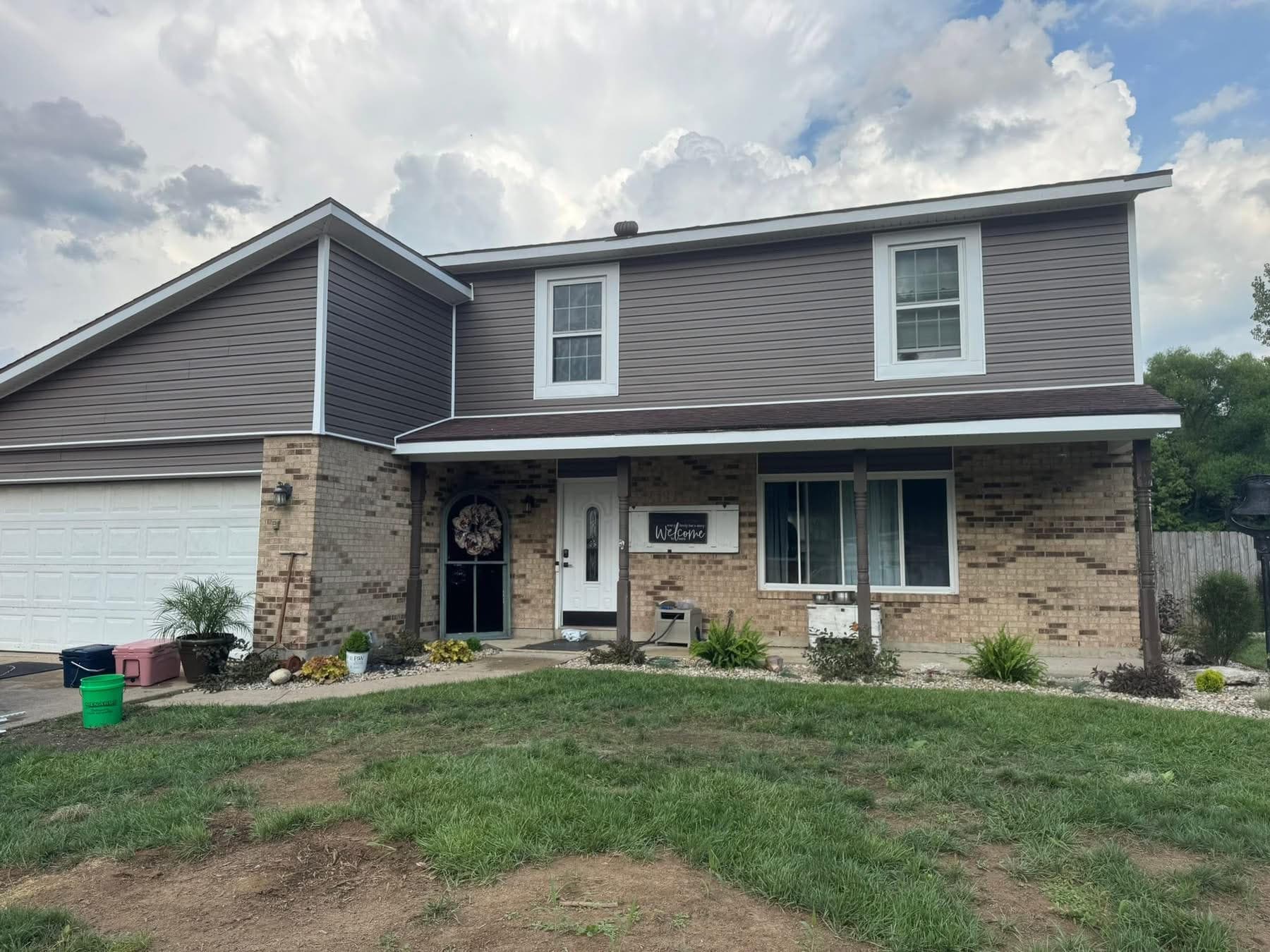 Charcoal brown vinyl siding replacement full front view by 937 Precision in Dayton Ohio