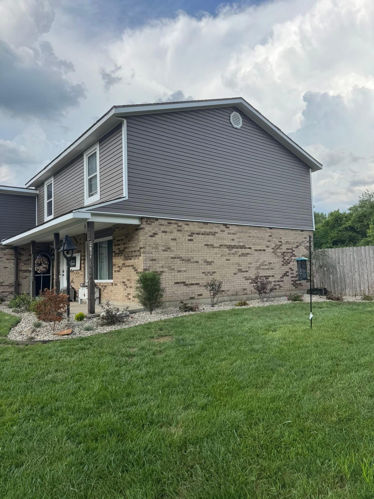 Charcoal brown vinyl siding two story home side view by 937 Precision in Dayton Ohio