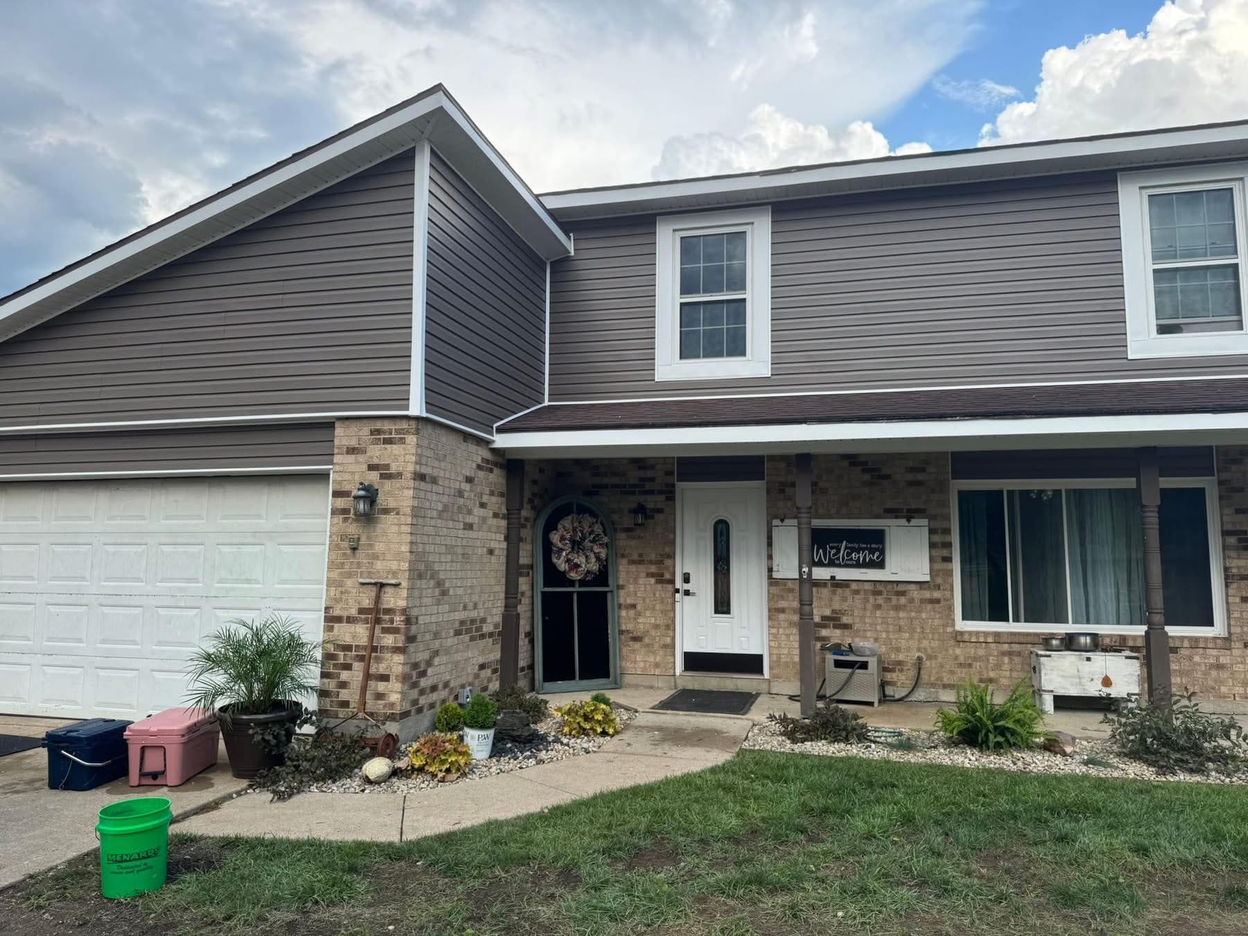 Charcoal brown vinyl siding two story home with garage by 937 Precision in Dayton Ohio