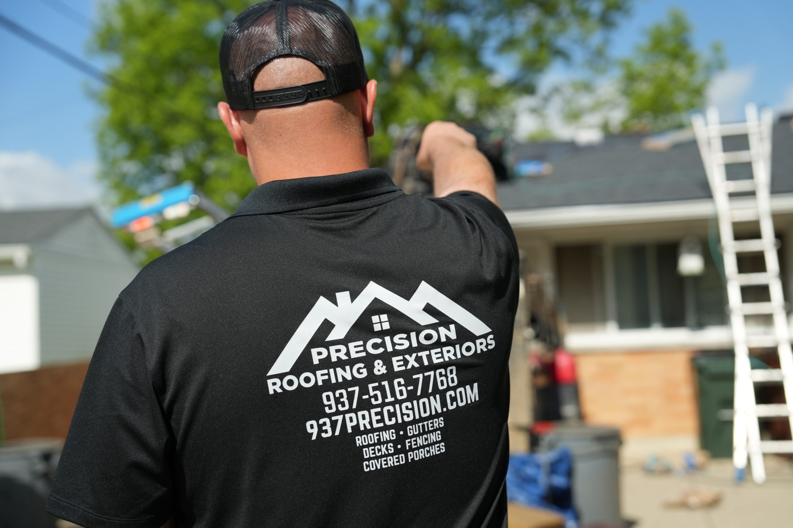 937 Precision branded polo shirt with contact information