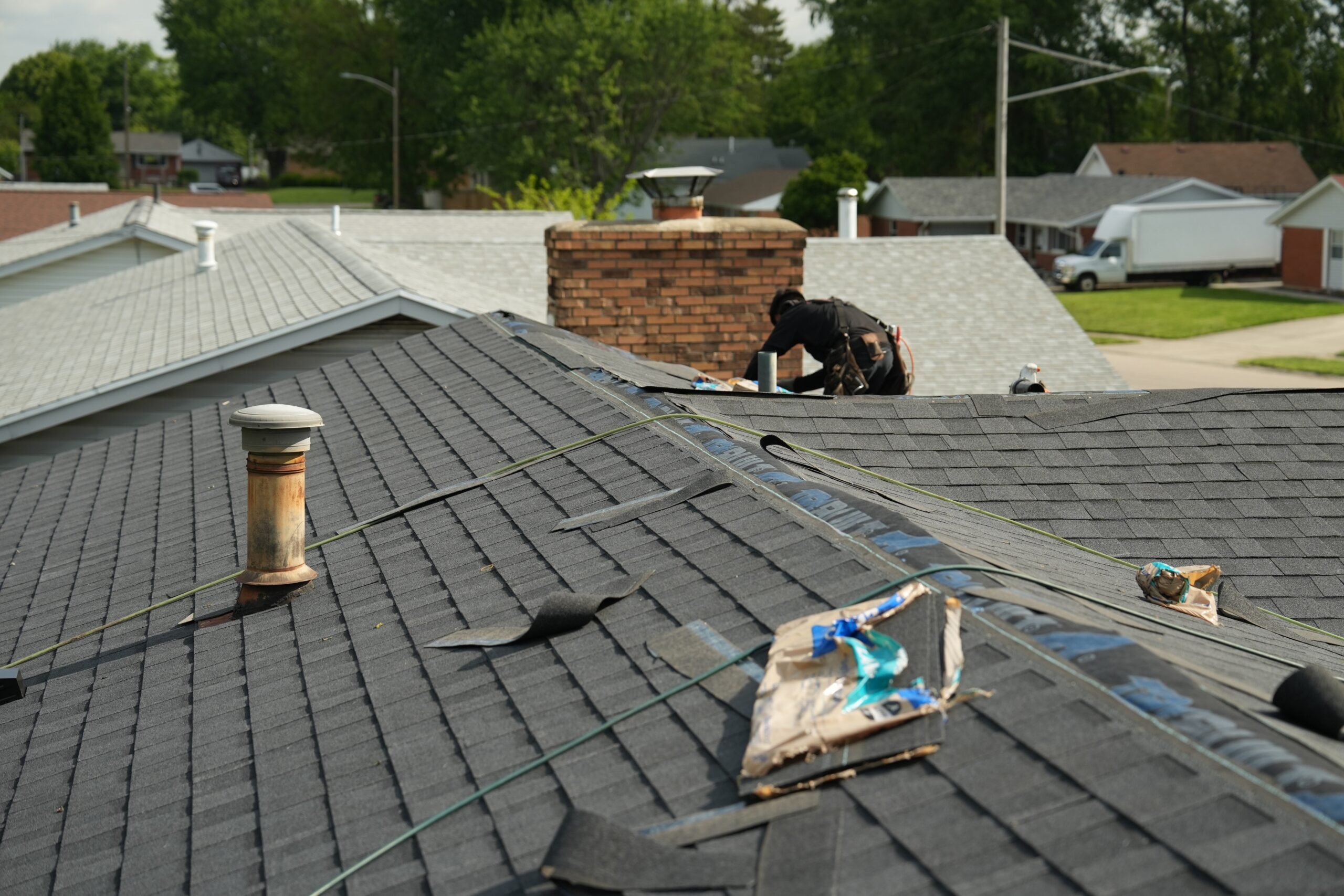 Roof repair near brick chimney completed by 937 Precision in Dayton Ohio