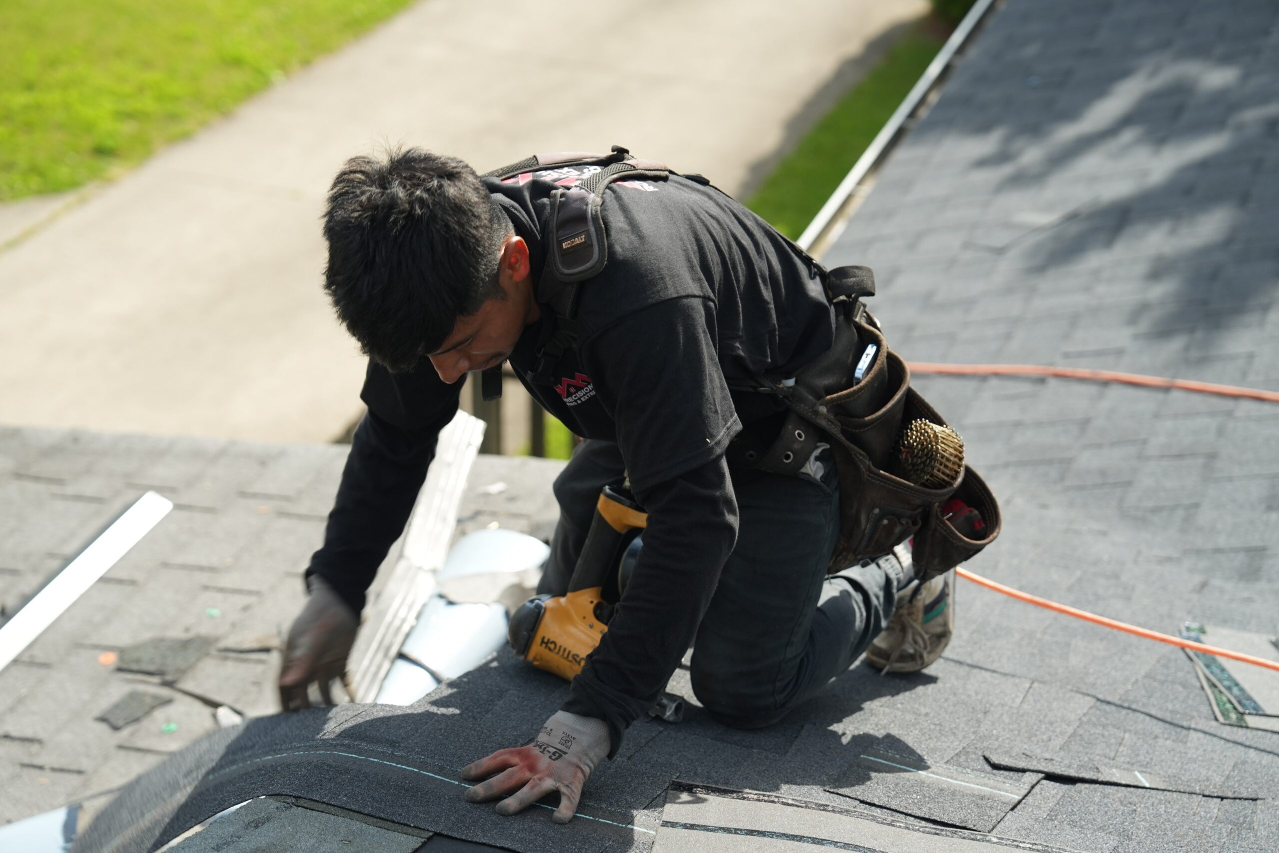 937 Precision roofer installing asphalt shingles