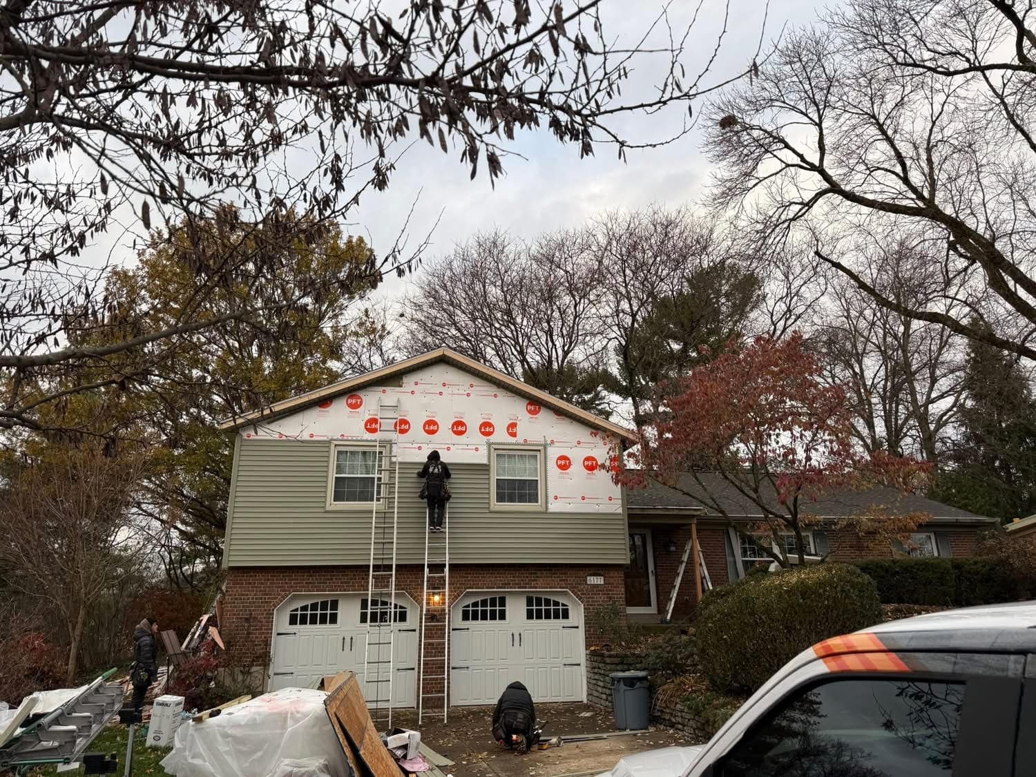 Vinyl siding installation in progress on a two story brick home by 937 Precision in Dayton Ohio